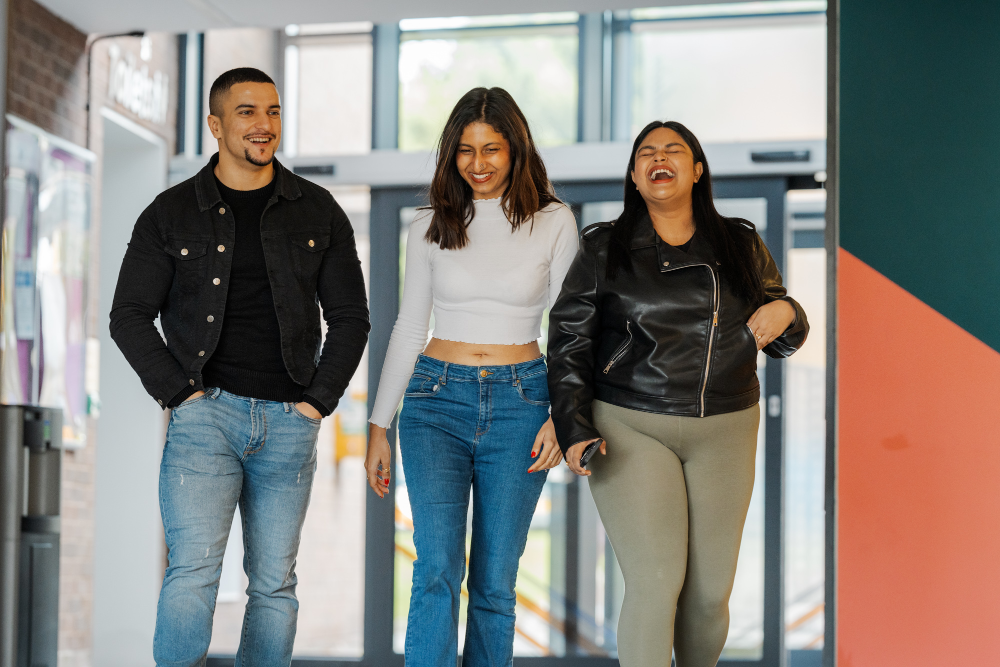 International students laughing together as they walk