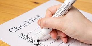 A student ticking tasks on a checklist