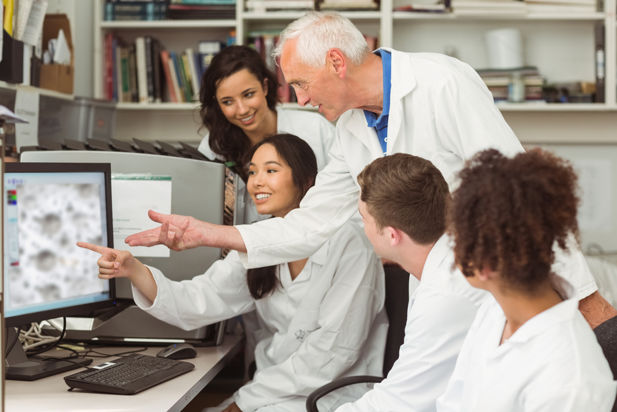 Scientist with students (Shutterstock image)