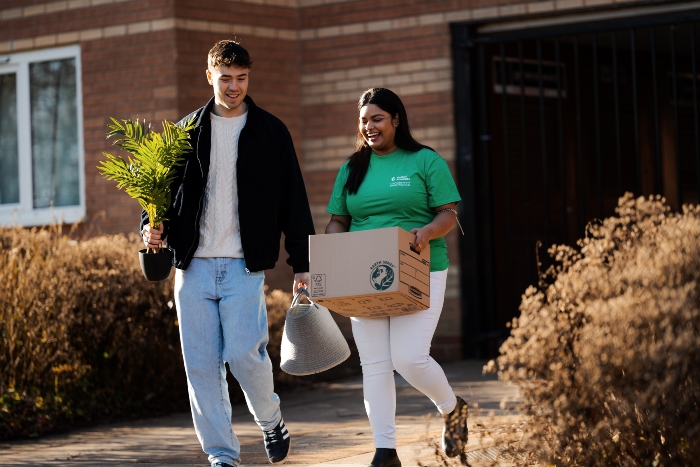 Student ambassador helping new student move into their accommodation.