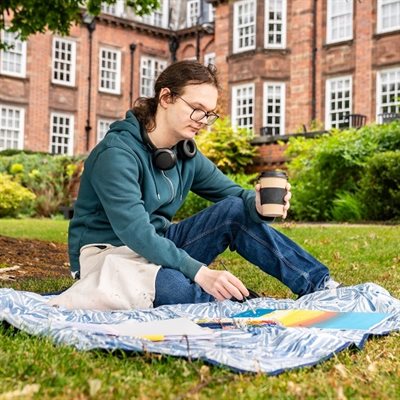 person sat on picnic blanket