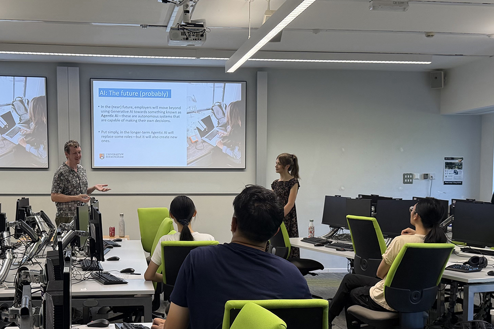 Two speakers presenting about AI in a lecture room