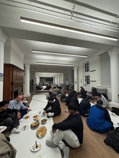group of people eating togther for Iftar