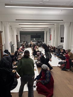 igroup of people eating together for Iftar