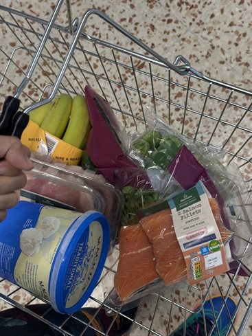 A basket of food in a supermarket