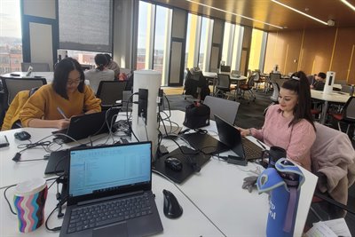 A photo of Katrina and a friend studying in the Main Library.