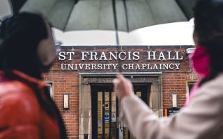 front of the building with umbrella