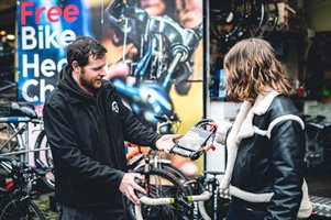 Photo of man and lady looking at a d-lock