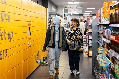 Two female students food shopping