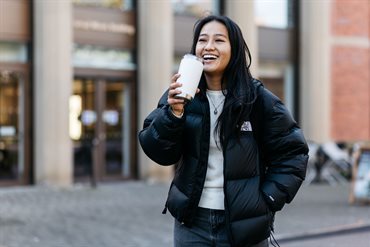 Female student with reusable cup drinking